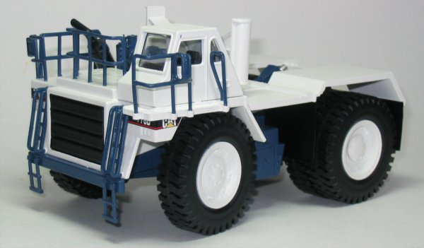 Cat 776D with Mega bottom dump trailer