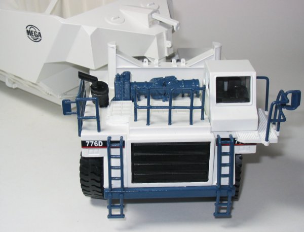 Cat 776D with Mega bottom dump trailer